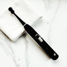  Snow Pearl elektrische Zahnbürste mit innovativer Schalltechnologie für gründliche Plaque-Entfernung.